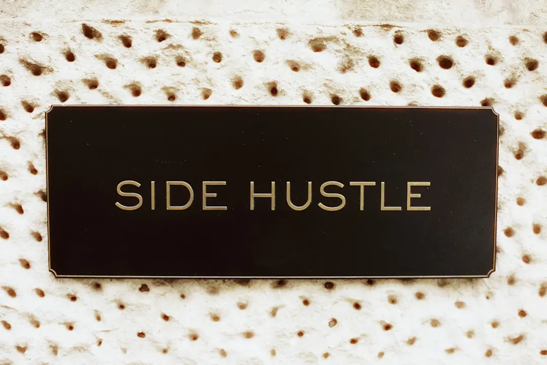 Black rectangle with "side hustle" text on textured background.